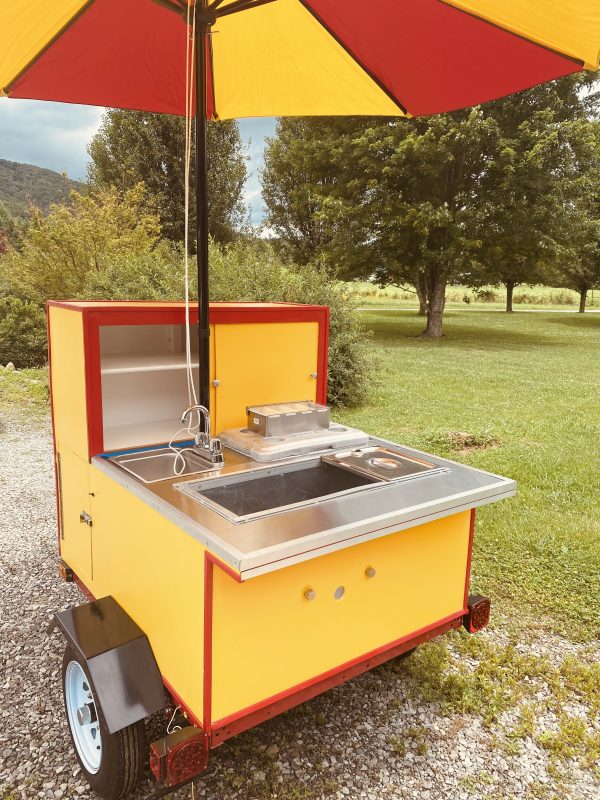 hot dog cart with umbrella