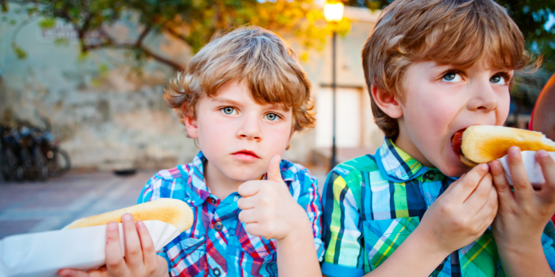 Food Vending Opportunity - kids eating hot dogs back to school